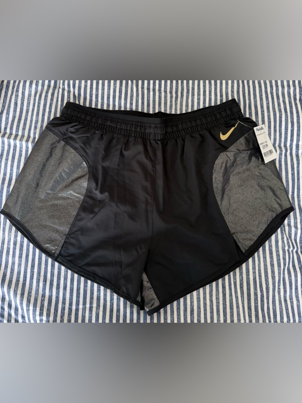 Nike Black Athletic Shorts with Gray Panels and Gold Swoosh